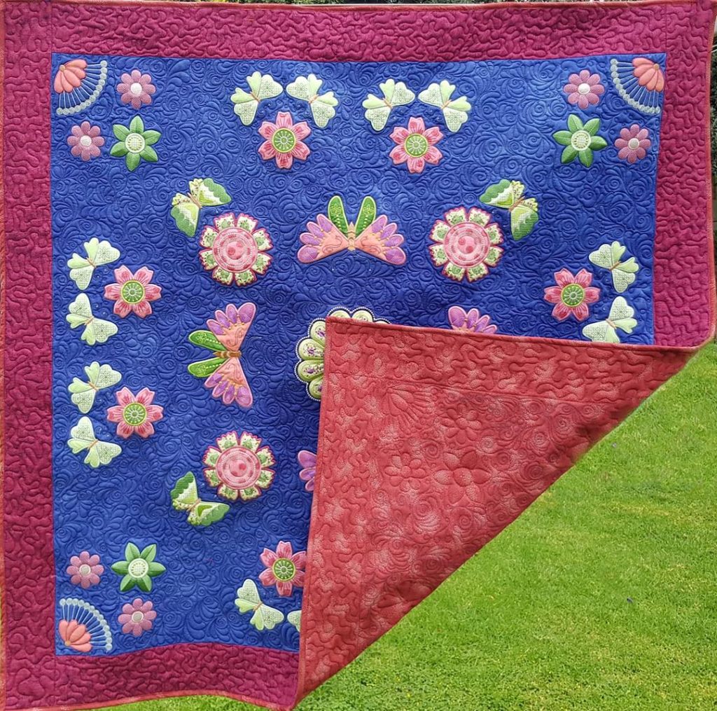 Butterfly in my garden, machine embroidery on whole cloth