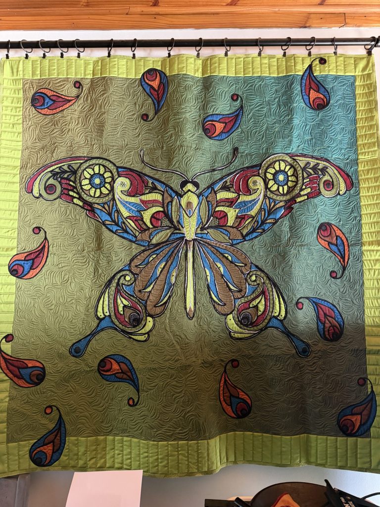 Butterfly panel on synthetic silk