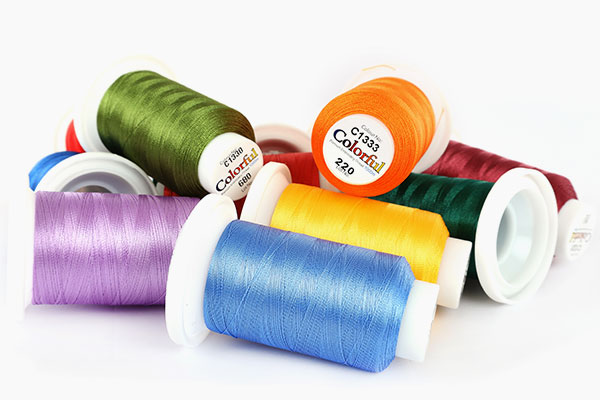 Colourful embroidery thread spools, available from embroidery warehouse in Kramerville Gauteng.